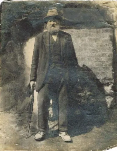 Archive portrait of a farmer standing in a yard