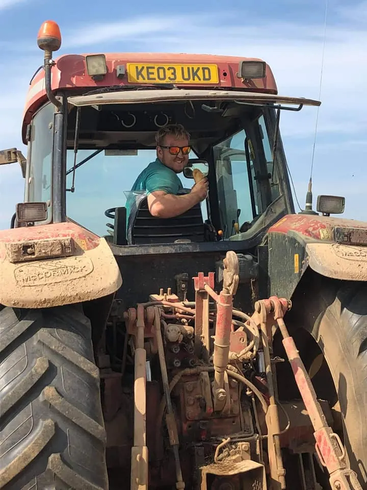 Driving the tractor on the farm