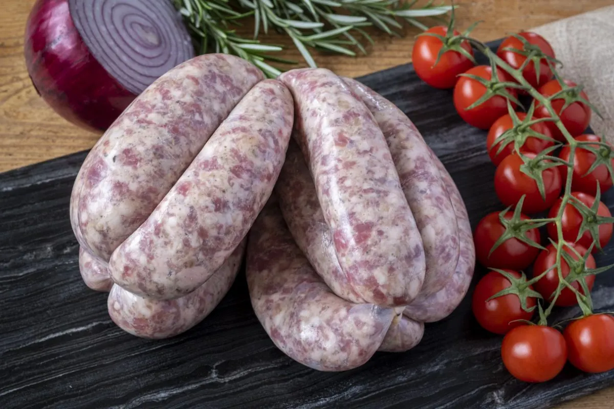 Sausages with cherry tomatoes and herbs